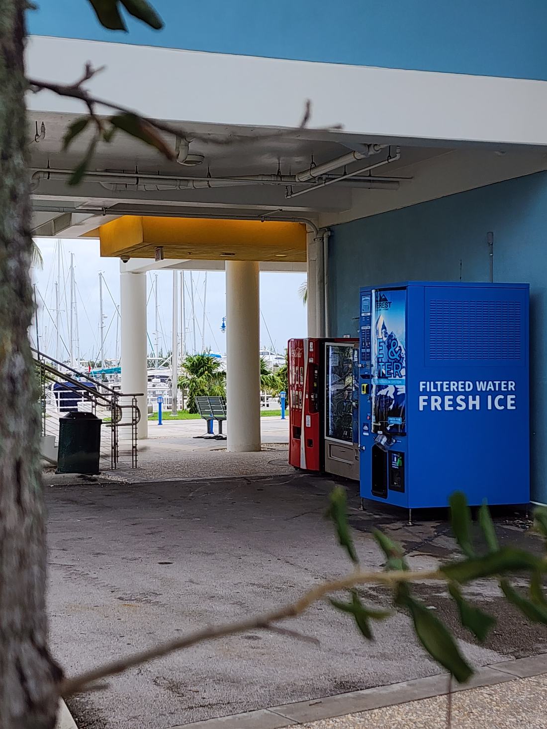 A Pure Ice USA vending machine installed at a marina